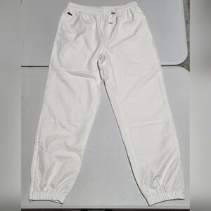 Lacoste sweatpants feature a classic logo patch on the hip